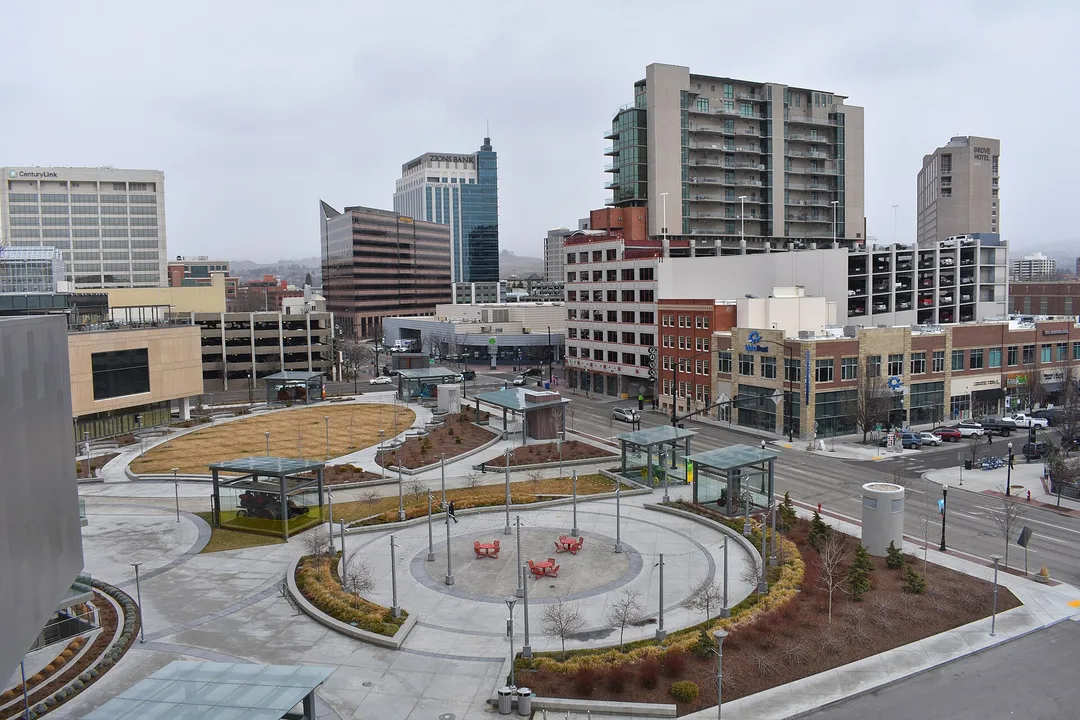 Curving paths and landscaped public spaces among downtown buildings in Idaho.